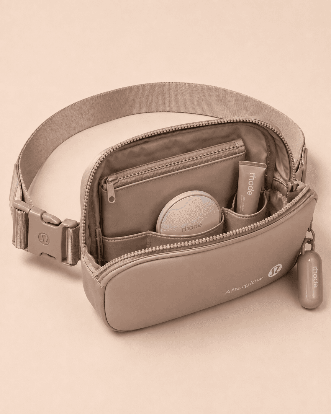 Afterglow Belt Bag open interior with rhode skincare compartments